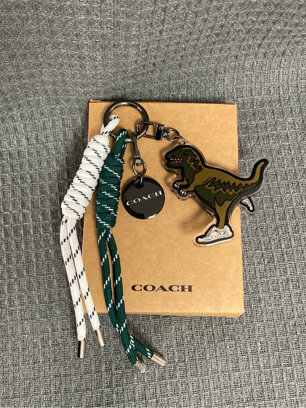 Coach Green & White Dino Tassel Keyring with Branded Disc